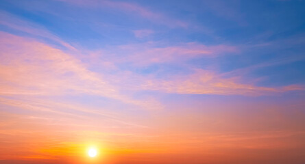 Colorful sunrise sky in the morning with orange sunlight clouds on idyllic horizontal sky...