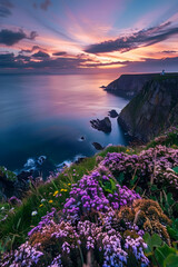 Dreamy Sunset over the Breathtaking Irish Coast Featuring Rolling Cliffs and a Silent Lighthouse