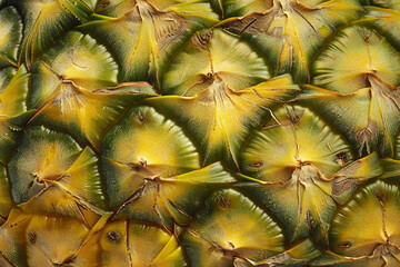 Fototapeta premium Close-up of pineapple skin texture providing a rich detail of the fruit's unique pattern.