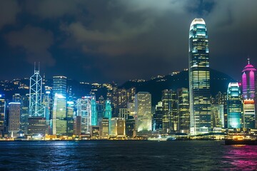 Obraz premium Marvel at the beauty of a city skyline at night, where skyscrapers are illuminated by a dazzling display of lights that dance across the dark sky, Generative AI