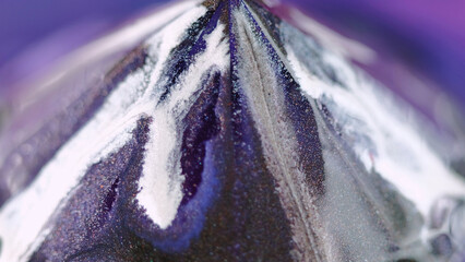 Glitter pyramid. Paint drop. Defocused neon blue purple white color glowing shimmering particles...