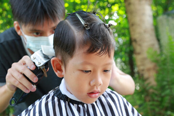 Asian little boy with fashion haircut for a guy. - 761951026