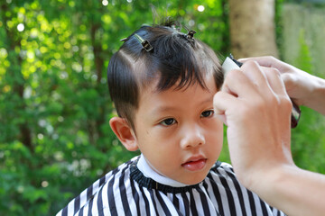 Asian little boy with fashion haircut for a guy. - 761951031
