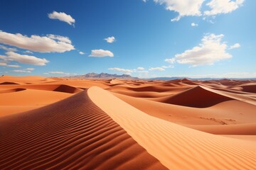 Fototapeta na wymiar A desert landscape with sand dunes, mountains, and a clear blue sky