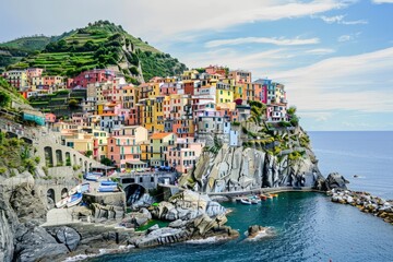 Wander through a picturesque coastal town, where colorful buildings perch on cliffs overlooking the...