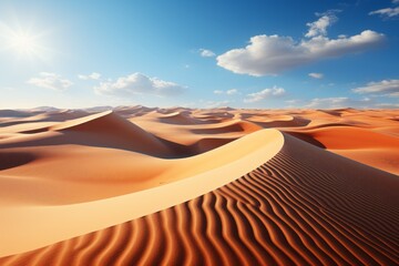 A natural landscape of sandy dunes under a blue sky in the desert