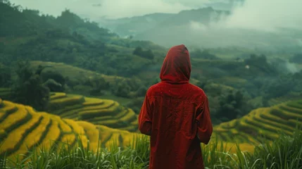 Foto auf Acrylglas The back of a young man wearing a red hood Walking on terraced rice fields With a magnificent view of Sao Yokarn Mountain © 2D_Jungle
