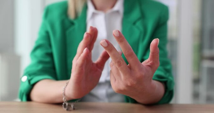 Woman worker bends fingers counting days until vacation