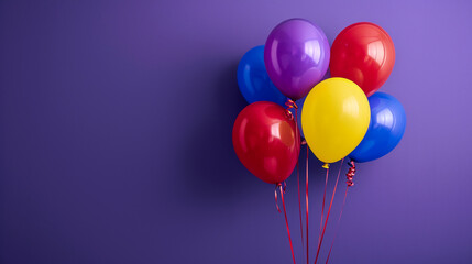 A bunch of colorful balloons on purple 