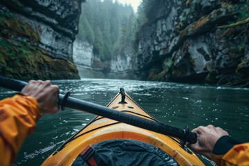 A person wearing a yellow kayak navigates down a river, paddling through calm waters