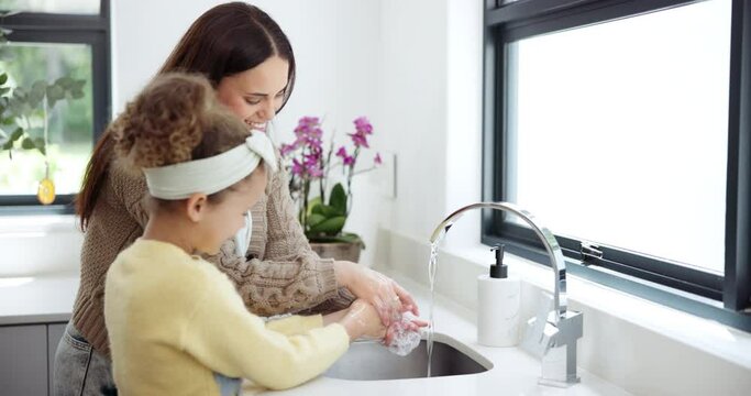 Family, mother and girl in a kitchen, washing hands or hygiene with cleaning or learning with routine. Apartment, home or mama with kid or single parent with daughter, wellness or grooming with water