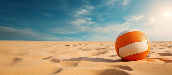 Volleyball ball on sandy beach
