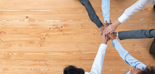 Top view panoramic banner hand stack by office worker show solidarity teamwork and trust in...