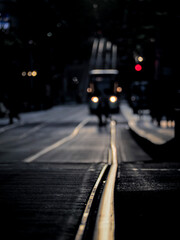 backlit street with railway