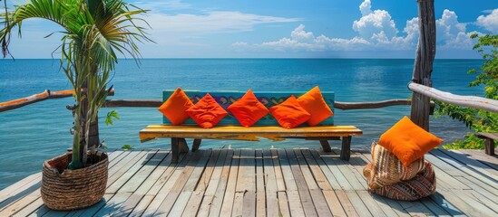 Vibrant Wood Pier with Ocean View and Colorful Pillows - obrazy, fototapety, plakaty