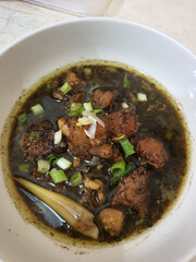 Rawon is an Indonesian beef soup. Originating from East Java, rawon utilizes the black keluak nut as the main seasoning, which gives a dark color and nutty flavor to the soup.