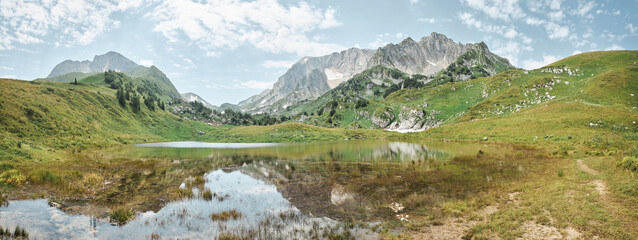 The high mountain Pshekha-Su and the mountain lake Psenodakh in the Caucasus mountains. The natural landscape. The high-altitude area of the Caucasian Nature Reserve