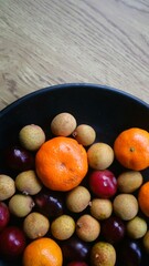 Various fruits served on black plate