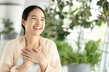 Happy, smiling, friendly asian woman in casual dress, showing being impressed gesture expression.