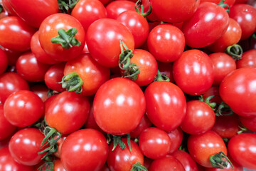 Cherry tomatoes in the market. Close-up. Background.