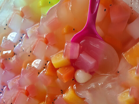 Es Kolang-Kaling/Iced Palm Fruit made with syrup, pandan leaves, and fruit cocktail. An Indonesian typical dessert during Ramadan month and Eid Al-Fitr or Hari Raya
