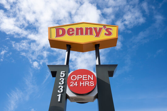 Pleasanton, CA, USA - Feb 21, 2024: Denny's signpost is seen outside one of its restaurants in Pleasanton, California. Denny's Corporation is an American table service diner-style restaurant chain.