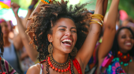A lively, vibrant group of women are dancing and laughing together in a jubilant celebration of Juneteenth Freedom Day