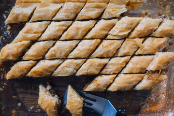 homemade glass baking dish with diamond shaped baklava dessert