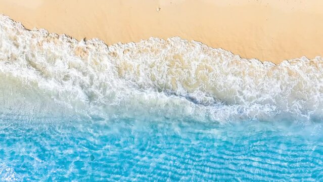 Top view of sandy beach for summer vacation concept. Nature of the beach and sea in summer with sunlight, and light sand. The sea sparkles against the blue sky. Sandy Beach for summer vacationconcept.