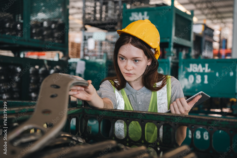 Sticker woman engineer in uniform helmet inspection check control heavy machine robot arm construction installation in industrial factory. technician worker check for repair maintenance electronic operation