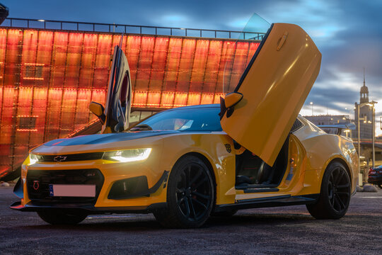 Chevrolet Camaro ZL1 with gullwing doors.Presentation against a background of beautiful illuminations