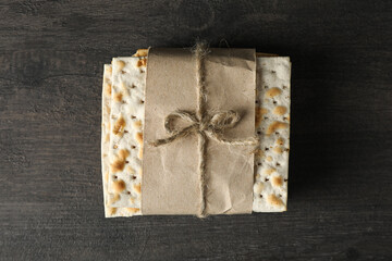 Unleavened Jewish bread on wooden background, top view