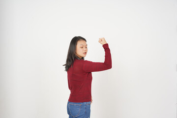 Young Asian woman in Red t-shirt Showing strong arms, emancipation of women concept isolated on...