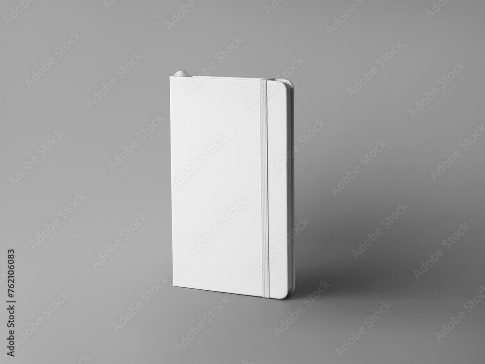 Poster mockup of a white closed notebook with an elastic band, bookmark, textured hardcover, isolated on a 