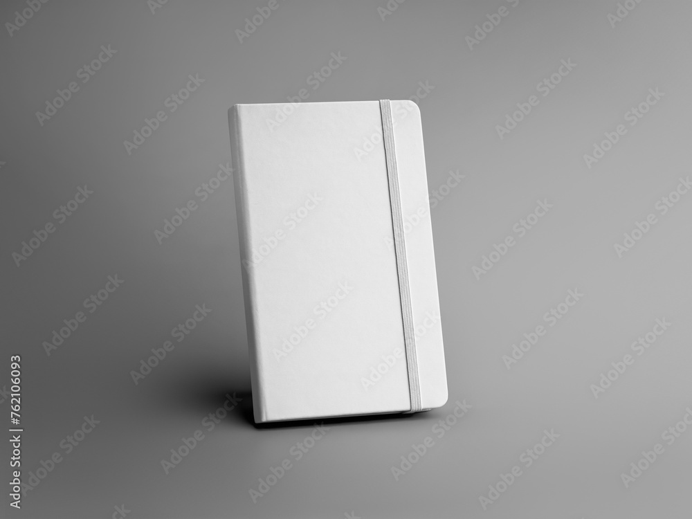 Poster mockup of a white closed notebook with an elastic band, textured hard cover for design, branding.