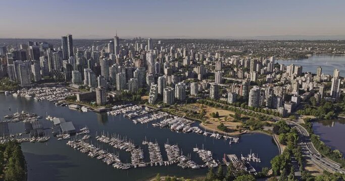 Vancouver BC Canada Aerial v86 drone flyover Stanley Park capturing bayshore marina, waterfront Coal Harbour, West End neighborhood and downtown cityscape  - Shot with Mavic 3 Pro Cine - July 2023