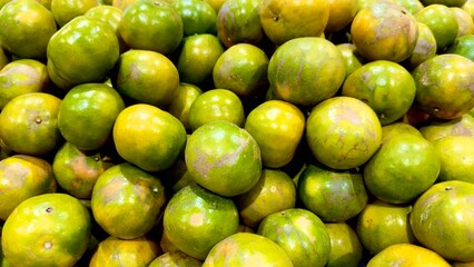 Orange fruit from Bangmod a native Thai species with a sweet flavor and thin skin. It is well-liked.