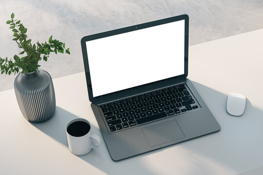 Laptop with isolated screen on white desk with coffee and green plant, modern minimalist. Remote work concept. 3D Rendering