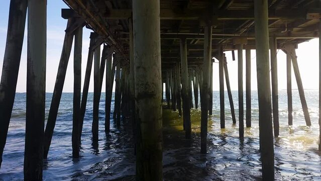 Extending 600 feet into the ocean, The peir at old orchard beach is a major tourist attraction.  Under the Pier
