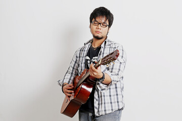 a guitarist playing acoustic guitar with a white background