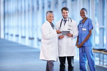 Portrait, tablet and smile of medical group in hospital for healthcare service in clinic. Happy...