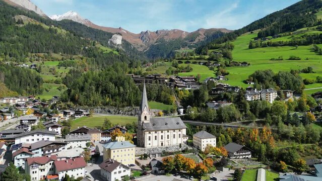 Matrei in Osttirol Church in Tyrol, Hohe Tauern National Park, Austria - Aerial 4k Circling