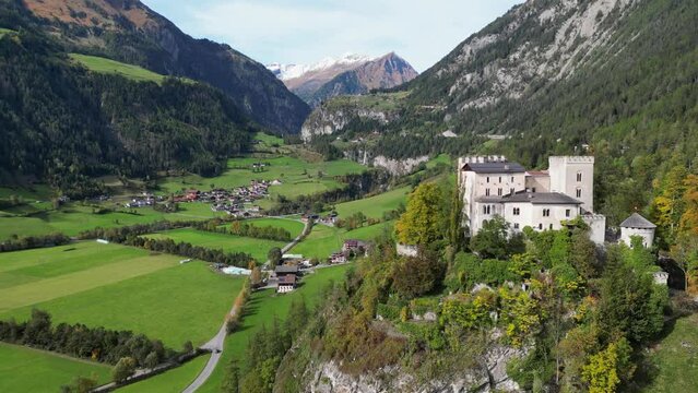 Weissenstein Castle on Top of a Cliff in Matrei in Osttirol, Isel Valley, Tyrol, Austria - Aerial 4k