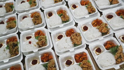 Rows of packages of rice box, crispy chicken and seasoned eggs