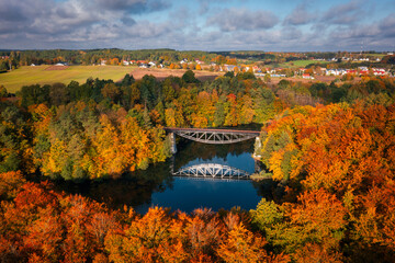 Fototapeta na wymiar Autumnal landscape of the forest and twisted Radunia river in Kashubia. Poland