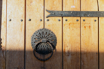 The Elegant Metal Decoration on a Wooden Door