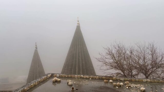 Misty, foggy, rainy day in Lalish, Kurdistan Iraq overlooking the Yazidi Temple spires