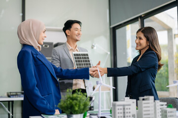 Naklejka premium .Business people having consultation about wind energy at company office. Business team discussing about windmill and alternative green enery. Net zero and carbon neutral concept