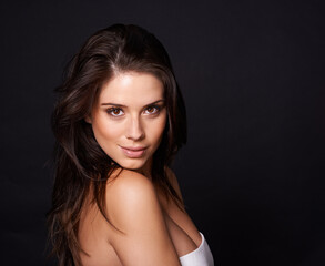 Naklejka premium Smile, portrait or woman in studio for skincare, wellness or collagen dermatology on black background. Beauty, face or happy female model with glowing skin treatment, results or cosmetic satisfaction