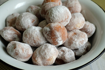 There are donuts in the bowl. Selective focus.
